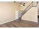 Open floor plan living room featuring a staircase and hardwood flooring at 1603 S Flanders Way, Aurora, CO 80017