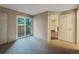 A carpeted bedroom with access to a patio at 6705 S Field St # 803, Littleton, CO 80128