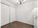 Dining area featuring a modern chandelier and storage closet at 6705 S Field St # 803, Littleton, CO 80128