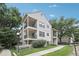 Apartment building showcases a two-story exterior with balconies and well-maintained landscaping at 6705 S Field St # 803, Littleton, CO 80128