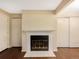 Close-up of a fireplace with white tile and black interior at 6705 S Field St # 803, Littleton, CO 80128