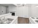 Kitchen featuring stainless steel sink, modern countertops, and dining area at 6705 S Field St # 803, Littleton, CO 80128