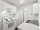 Kitchen with white appliances and countertops at 6705 S Field St # 803, Littleton, CO 80128