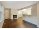 Inviting living room with hardwood floors and a cozy fireplace at 6705 S Field St # 803, Littleton, CO 80128