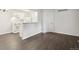 Open living area featuring modern flooring, neutral paint, and open access to the kitchen at 6705 S Field St # 803, Littleton, CO 80128