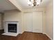 Cozy living room with hardwood floors and a fireplace at 6705 S Field St # 803, Littleton, CO 80128