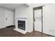 Living area featuring a modern fireplace, closet, and laundry area at 6705 S Field St # 803, Littleton, CO 80128