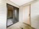 Enclosed patio featuring vinyl siding, sliding glass door, and access to the home at 6705 S Field St # 803, Littleton, CO 80128