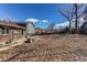 Spacious backyard featuring a patio, mature trees, and room for entertaining at 2863 S Biscay Ct, Aurora, CO 80013