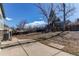 Large backyard with mature trees and a playset, perfect for outdoor activities at 2863 S Biscay Ct, Aurora, CO 80013