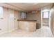 Basement bar area with tile and stairs to the right at 2863 S Biscay Ct, Aurora, CO 80013