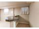 Basement bar area with granite countertop and tiled flooring at 2863 S Biscay Ct, Aurora, CO 80013