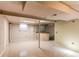 Unfinished basement with tiled flooring and support beams at 2863 S Biscay Ct, Aurora, CO 80013