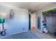 Bedroom with gray walls, carpet, closet, and doorway to another room at 2863 S Biscay Ct, Aurora, CO 80013