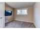 Bedroom featuring neutral walls, carpeting and a bright window at 2863 S Biscay Ct, Aurora, CO 80013