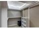 Walk-in closet includes shelving and built-in lighting at 2863 S Biscay Ct, Aurora, CO 80013