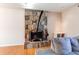 Living room fireplace with a stone surround and hearth at 2863 S Biscay Ct, Aurora, CO 80013