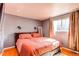 Main bedroom with wood flooring and a window that provides natural light at 2863 S Biscay Ct, Aurora, CO 80013