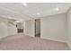 Spacious basement area offers flexible space for recreation or storage with carpeted floors at 17166 Yellow Rose Way, Parker, CO 80134