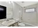 Clean bathroom with a tub and shower, tile surround, and a granite countertop at 17166 Yellow Rose Way, Parker, CO 80134