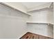 Walk-in closet with shelving and wood-look flooring provides ample storage space at 17166 Yellow Rose Way, Parker, CO 80134
