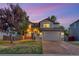 Charming two-story home featuring a well-manicured lawn and an attached two-car garage at 17166 Yellow Rose Way, Parker, CO 80134