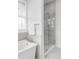 Luxurious bathroom with a soaking tub and glass shower enclosure at 6485 E Cedar Ave, Denver, CO 80224