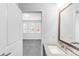 Bright bathroom with a sink vanity and a view into the bedroom at 6485 E Cedar Ave, Denver, CO 80224