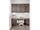 Built-in desk with cabinets and drawers, providing ample storage and workspace at 6485 E Cedar Ave, Denver, CO 80224