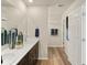 Elegant bathroom with dual sinks, stylish vanities, and modern fixtures at 20802 E 66Th Ave, Aurora, CO 80019
