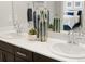 Bathroom with double sinks, modern decor, and sleek finishes at 20802 E 66Th Ave, Aurora, CO 80019