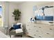 Cozy bedroom decor with a reading chair, a bright window, and contemporary art at 20802 E 66Th Ave, Aurora, CO 80019
