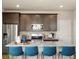 Kitchen with stainless steel appliances, granite counters, and stylish breakfast bar at 20802 E 66Th Ave, Aurora, CO 80019