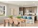 Modern kitchen featuring granite countertops, stainless steel appliances, and breakfast bar at 20802 E 66Th Ave, Aurora, CO 80019