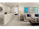 Upstairs loft/living room area with comfortable seating and colorful decor at 20802 E 66Th Ave, Aurora, CO 80019
