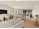 Open living space with hardwood floors, dining area, and modern kitchen at 20802 E 66Th Ave, Aurora, CO 80019