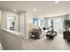 Upstairs loft/living room area with comfortable seating and natural light at 20802 E 66Th Ave, Aurora, CO 80019