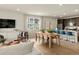 Bright and open living area with seamless flow into the modern kitchen at 20802 E 66Th Ave, Aurora, CO 80019