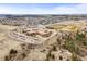 Aerial view of school, athletic fields, and neighborhood featuring scenic views of the surrounding area at 650 Bishop Pine Way, Castle Rock, CO 80104