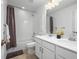Bright bathroom featuring a shower-tub, double sink, and matching hardware at 650 Bishop Pine Way, Castle Rock, CO 80104