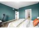 Comfortable bedroom with view of ensuite bath, a calming color palette, and ample natural light at 650 Bishop Pine Way, Castle Rock, CO 80104