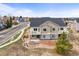 New construction townhome showcases stone accents, balcony, well-kept yard, and a convenient location at 650 Bishop Pine Way, Castle Rock, CO 80104