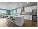 Open concept kitchen features a large island, stainless steel appliances, and modern finishes at 650 Bishop Pine Way, Castle Rock, CO 80104