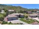 Low aerial view of a charming single Gathering home with a three car garage at 10950 Elk Horn Run, Littleton, CO 80125