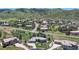 Aerial view of property showcasing the beautiful home and neighborhood nestled against mountain views at 10950 Elk Horn Run, Littleton, CO 80125