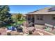 Backyard patio area featuring a grill, dining table, and solar panels at 10950 Elk Horn Run, Littleton, CO 80125