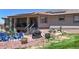 Backyard patio area featuring a grill, dining table, and solar panels at 10950 Elk Horn Run, Littleton, CO 80125