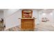 Basement bar area with custom cabinetry and lighting at 10950 Elk Horn Run, Littleton, CO 80125