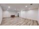 Large, open finished basement features recessed lighting, tile floors, and ample space at 10950 Elk Horn Run, Littleton, CO 80125