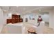 Spacious finished basement with recessed lighting, built in shelves, and comfortable seating area at 10950 Elk Horn Run, Littleton, CO 80125
